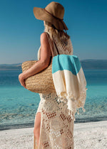 luxury minimalist lifestyle Turkish beach towel with tassels artisan handloomed, boho girl at the beach with Tranquil throw Bezzazan