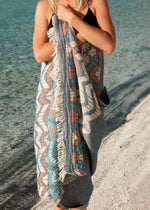 Affectionate Bezzazan stylish soft artisan Turkish beach towel, model in swimsuit cover, blue tribal boho chic modern design 