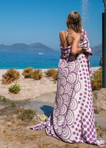 boho girl in outdoor shower on beach wrapped in Turkish towel with tassels, amethyst color mandala design - Passionate Bezzazan