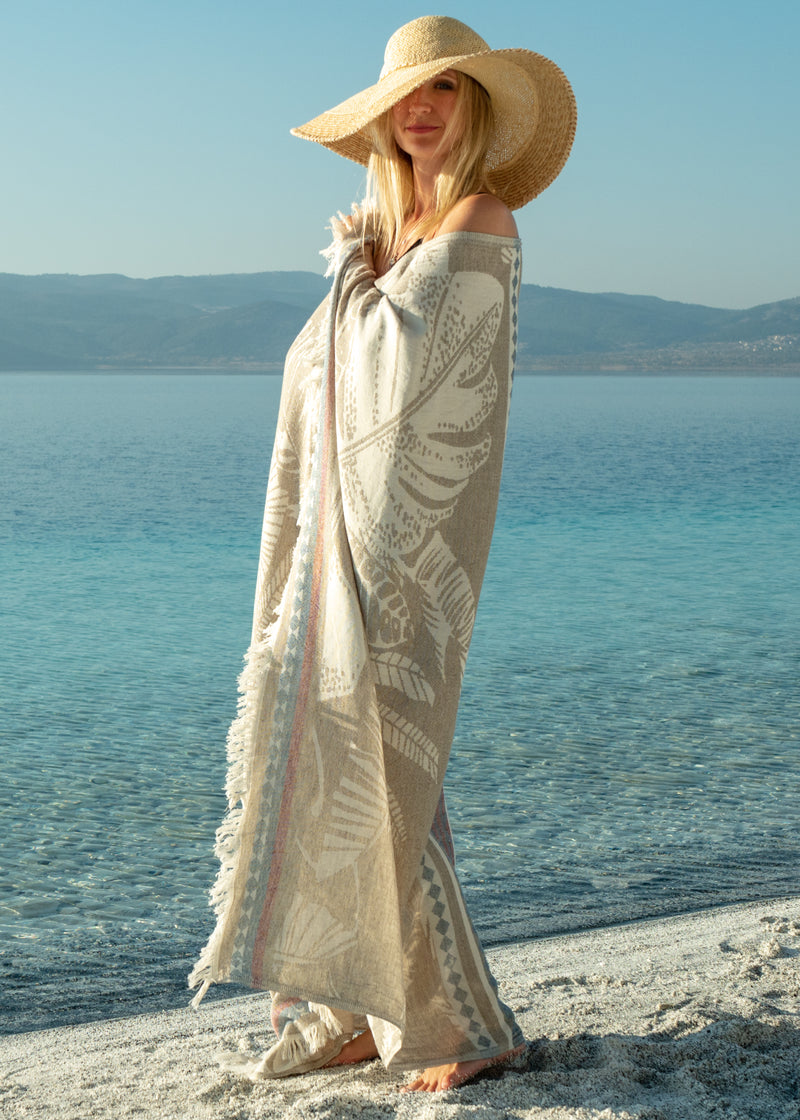 Flourishing Oversized Luxury Turkish Towel Bezzazan, as swimsuit cover on boho girl in hat on beach